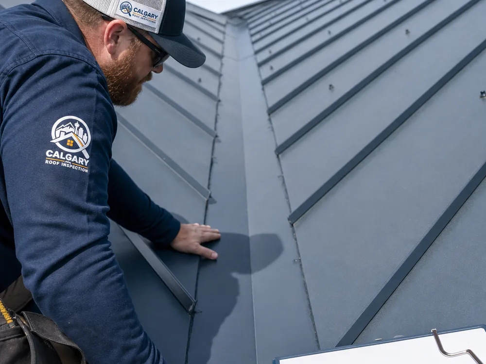 Metal roof valley with clean valley metal, correct overlaps, and neat sealant application